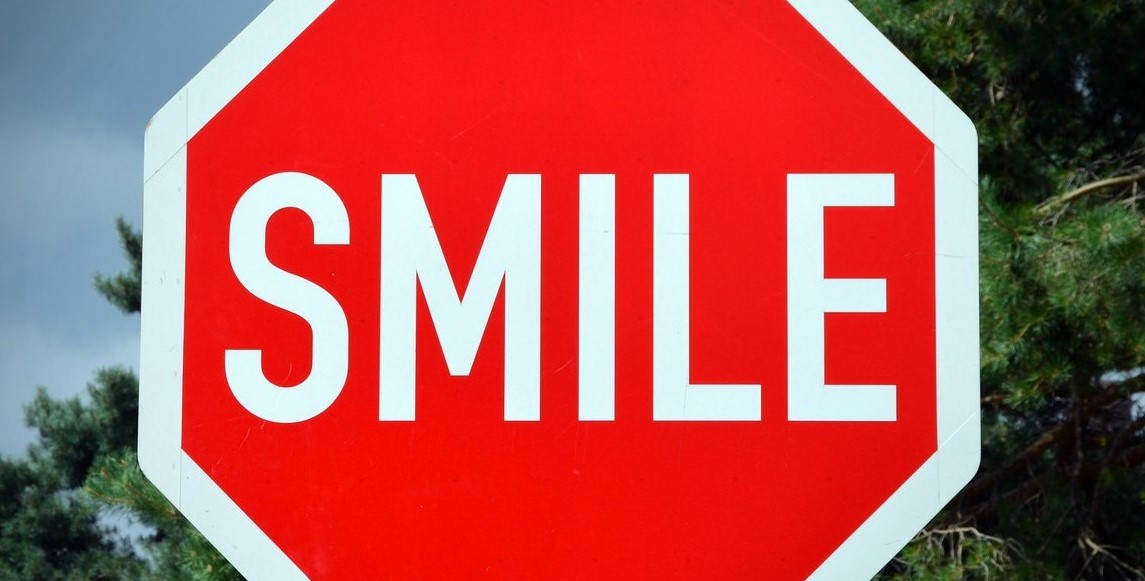 Smile road sign